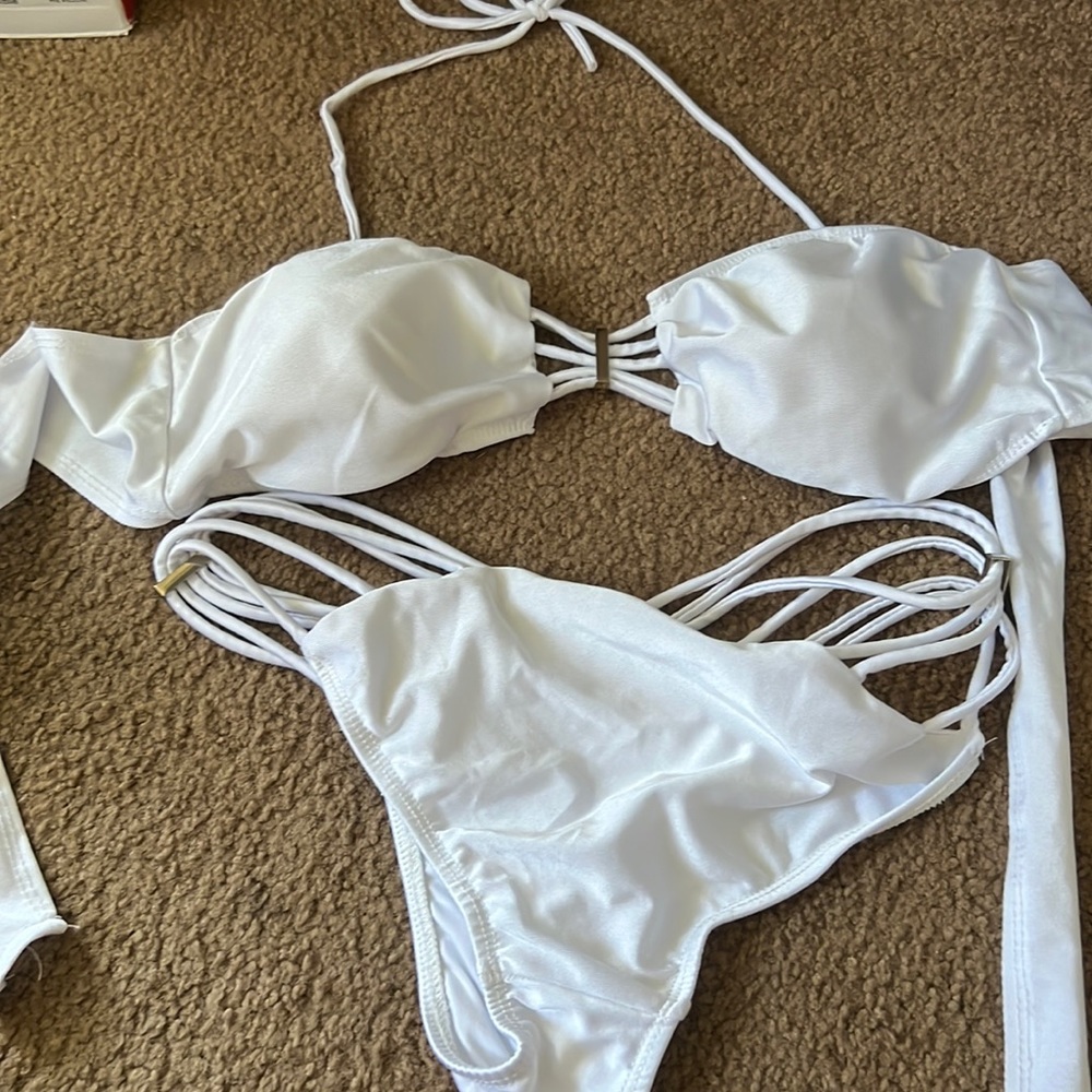 Sexy revealing bikini. Very strappy.